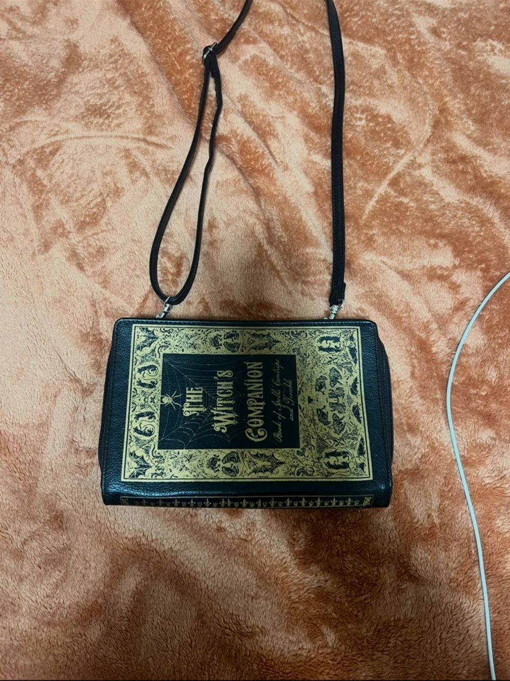 Black Crossbody Book-Style Bag with Gold Embossed Design